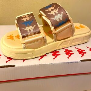 kappa slides they are a size 4 in men. cream color with blue and yellow.